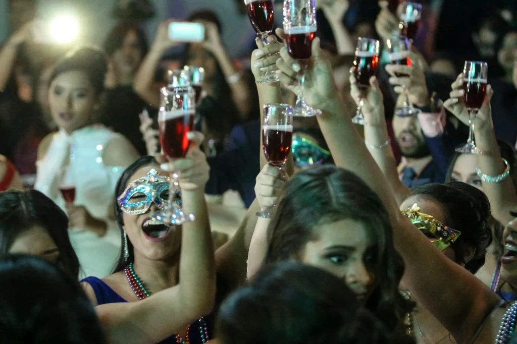 Group celebrating with champagne on a Los Angeles party bus night